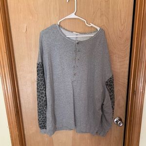 Grey sweater with cheetah print sleeves